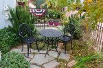 Charming outside seating area is ideal for your morning cup of coffee